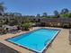 Inviting community pool with ample deck space, surrounded by lush landscaping and well-maintained buildings at 13385 Arbor Pointe Cir # 203, Tampa, FL 33617