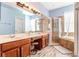 The primary bathroom features a double vanity, soaking tub, walk-in shower, and lots of natural light at 16313 Dinsdale Dr, Spring Hill, FL 34610