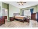 The main bedroom features wood-look floors, a large window, and neutral-colored walls at 16313 Dinsdale Dr, Spring Hill, FL 34610