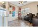 A functional office space featuring decorative posters, wood-look floors and ample natural light at 16313 Dinsdale Dr, Spring Hill, FL 34610