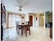 Bright dining room with tile flooring and a ceiling fan, perfect for Gathering gatherings and entertaining at 17010 Aspen Meadows Dr, Lutz, FL 33548