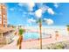 Stunning aerial view of a pristine beach, pool, and surrounding landscape at 17940 Gulf Blvd # 2B, Redington Shores, FL 33708