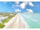 Beautiful aerial view of a sandy beach with houses and condos on the left at 17940 Gulf Blvd # 2B, Redington Shores, FL 33708