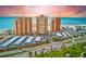 Stunning aerial view of beachfront condos with covered parking and access to pristine beach at 17940 Gulf Blvd # 2B, Redington Shores, FL 33708