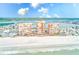 Breathtaking aerial of beachfront condos, white sandy beach, and pristine blue ocean at 17940 Gulf Blvd # 2B, Redington Shores, FL 33708