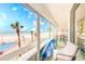 Inviting balcony with ocean views and a surfboard, perfect for coastal living at 17940 Gulf Blvd # 2B, Redington Shores, FL 33708