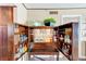 Elegant bar cabinet with mirrored backing, bottle storage, and a pull-out counter, perfect for entertaining at 17940 Gulf Blvd # 2B, Redington Shores, FL 33708