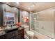 Sleek bathroom with a stylish vanity, a glass-enclosed shower, and modern fixtures at 17940 Gulf Blvd # 2B, Redington Shores, FL 33708