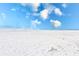 Beautiful white sandy beach with clear blue skies and calm ocean waters at 17940 Gulf Blvd # 2B, Redington Shores, FL 33708