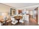 Cozy dining area features a round table with four chairs and opens to the kitchen area at 17940 Gulf Blvd # 2B, Redington Shores, FL 33708