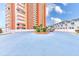 Well-maintained condo building with manicured landscaping and circular driveway at 17940 Gulf Blvd # 2B, Redington Shores, FL 33708