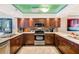 Updated kitchen boasts stainless appliances, granite countertops, and custom wood cabinets at 17940 Gulf Blvd # 2B, Redington Shores, FL 33708