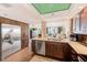 Modern kitchen with stainless appliances and granite countertops opens to the living room at 17940 Gulf Blvd # 2B, Redington Shores, FL 33708