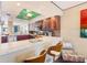 Modern kitchen with breakfast bar opens to the living room at 17940 Gulf Blvd # 2B, Redington Shores, FL 33708