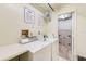 Functional laundry area with washers, dryers, and storage lockers at 17940 Gulf Blvd # 2B, Redington Shores, FL 33708
