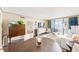 Bright living room with ocean views, sliding glass doors to balcony, and modern furnishings at 17940 Gulf Blvd # 2B, Redington Shores, FL 33708