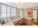 This cozy living room has a view, comfortable seating and lots of light at 17940 Gulf Blvd # 2B, Redington Shores, FL 33708
