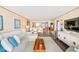 Spacious living area featuring ocean views, balcony access, and seamless flow to dining and kitchen at 17940 Gulf Blvd # 2B, Redington Shores, FL 33708