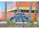 Redington Towers signage with address information and lush landscaping at 17940 Gulf Blvd # 2B, Redington Shores, FL 33708