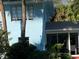Exterior view of blue building with well-maintained yard and lush landscaping at 1800 Pass A Grille Way # 5, St Pete Beach, FL 33706
