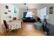Bright living room featuring hardwood floors, ceiling fan, and decor with a table and chairs in the foreground at 1800 Pass A Grille Way # 5, St Pete Beach, FL 33706