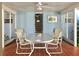 Charming patio area with tiled flooring, seating, and bright, airy ambiance, perfect for outdoor dining and relaxation at 1800 Pass A Grille Way # 5, St Pete Beach, FL 33706