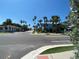 Attractive street view of a quaint neighborhood featuring lush palm trees and colorful houses at 1800 Pass A Grille Way # 5, St Pete Beach, FL 33706