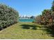 Beautiful water view overlooking calm, aqua waters with lush greenery on a sunny day at 1800 Pass A Grille Way # 5, St Pete Beach, FL 33706