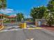 Gated entrance to the community with a decorative sign and colorful landscaping at 2009 Hammock Pine Blvd # 2009, Clearwater, FL 33761