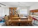 Dining room features a wooden table, upholstered chairs, and a vintage china cabinet at 2009 Hammock Pine Blvd # 2009, Clearwater, FL 33761