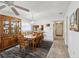 Traditional dining room with wood furniture, ceiling fan, and easy access to kitchen and entryway at 2009 Hammock Pine Blvd # 2009, Clearwater, FL 33761