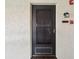 Inviting front door with stylish screen and charming address plaque at 2009 Hammock Pine Blvd # 2009, Clearwater, FL 33761