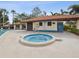 Inviting community hot tub and adjacent pool house with showers at 2009 Hammock Pine Blvd # 2009, Clearwater, FL 33761