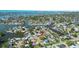 Aerial view of the neighborhood showcasing waterfront access with many canals and boat docks for easy boating access at 2037 Church Creek Pt, Largo, FL 33774