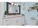 Bathroom featuring a granite countertop and coastal decorations at 2037 Church Creek Pt, Largo, FL 33774