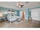 Calm bedroom with a king bed, ceiling fan, and ensuite bathroom entrance at 2037 Church Creek Pt, Largo, FL 33774