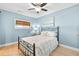 Bright bedroom with a ceiling fan and neutral decor at 2037 Church Creek Pt, Largo, FL 33774