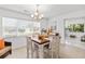 Inviting dining room with white trim, plenty of natural light, and comfortable seating at 2037 Church Creek Pt, Largo, FL 33774