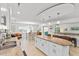 Open-concept kitchen with an island, dining area, and cozy seating at 2037 Church Creek Pt, Largo, FL 33774