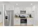 Modern kitchen boasts stainless steel appliances and granite countertops at 2037 Church Creek Pt, Largo, FL 33774