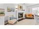 Cozy living room features a fireplace, comfortable seating, and beach-themed decor at 2037 Church Creek Pt, Largo, FL 33774