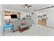 Open-concept living room with tile floors, modern decor, and seamless flow to the kitchen at 2037 Church Creek Pt, Largo, FL 33774