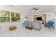 Bright living room featuring marble floors, modern decor, and large windows with natural light at 2037 Church Creek Pt, Largo, FL 33774