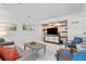 Comfortable living room with cozy furniture, colorful accent wall, and bright, natural light at 2037 Church Creek Pt, Largo, FL 33774