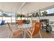 Outdoor patio with a dining table, chairs, grill and views of the backyard at 2037 Church Creek Pt, Largo, FL 33774
