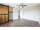 Comfortable bedroom featuring a sliding barn door closet and ceiling fan at 2080 Attache Ct, Clearwater, FL 33764