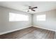 Bright bedroom with ample natural light from two large windows at 2080 Attache Ct, Clearwater, FL 33764