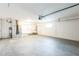 Spacious garage with sink, white walls, and water heater at 2080 Attache Ct, Clearwater, FL 33764