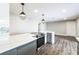 Newly updated kitchen with stainless steel appliances, modern countertops, and updated lighting at 2080 Attache Ct, Clearwater, FL 33764