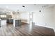 Open concept kitchen with updated cabinetry, new stainless appliances and vinyl flooring at 2080 Attache Ct, Clearwater, FL 33764